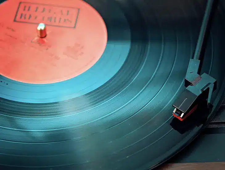 A close up of a vinyl record on a table, accompanied by a Letter from Symphonic's CEO.