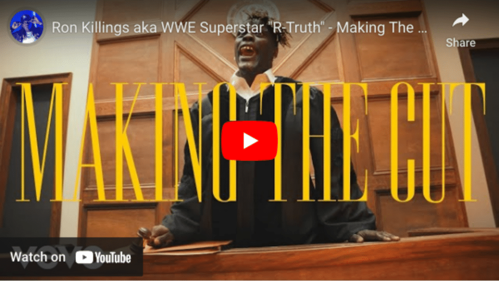 Thumbnail image for a youtube video distribution titled "Ron Killings aka WWE Superstar 'R-Truth' - Making the Cut," featuring R-Truth excitedly standing behind a desk with the title prominently