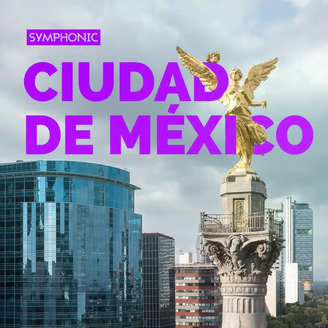 View of the Angel of Independence statue in Mexico City with modern skyscrapers in the background. Text overlay says "SYMPHONIC CIUDAD DE MÉXICO," providing insight about Symphonic harmony within a vibrant metropolis.