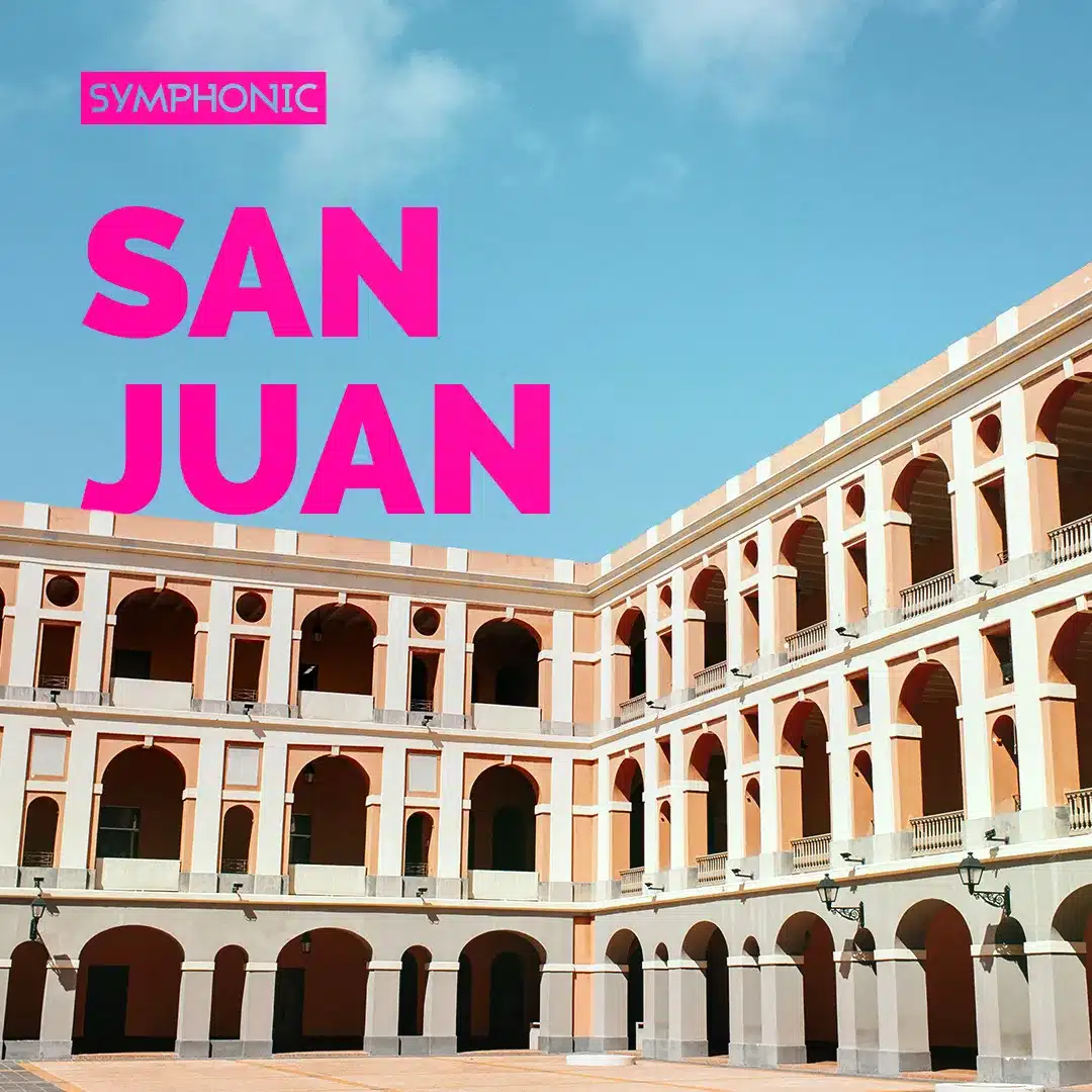 A courtyard surrounded by a three-story building with archways under a clear blue sky. Large pink text reads "Symphonic San Juan," inviting curiosity about Symphonic's enchanting presence and vibrant events.