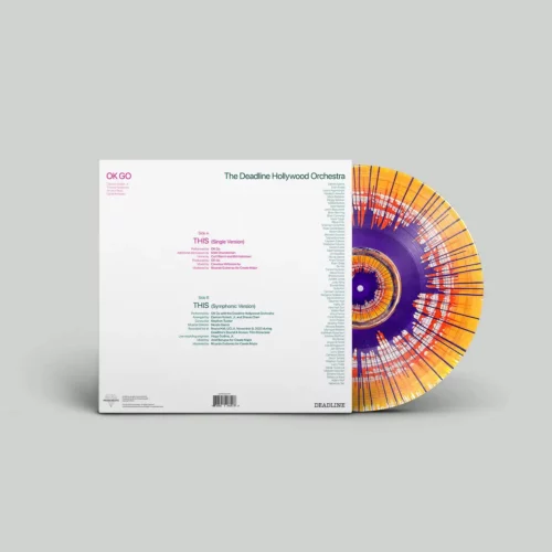 A vinyl record with an abstract orange and purple design, part of physical music distribution, is partially visible behind a white square album cover featuring track lists and credits for OK Go and The Deadline Hollywood Orchestra.