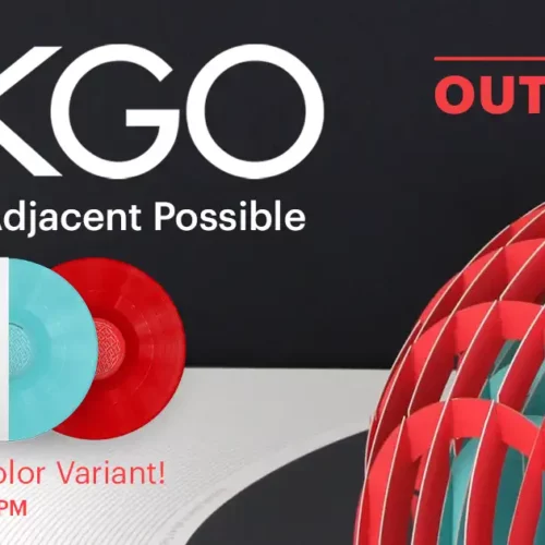 Two vinyl records, one red and one blue, are displayed next to an album cover and a geometric sculpture, highlighting OKGO's "And the Adjacent Possible" exclusive color variant—a celebration of physical music distribution.