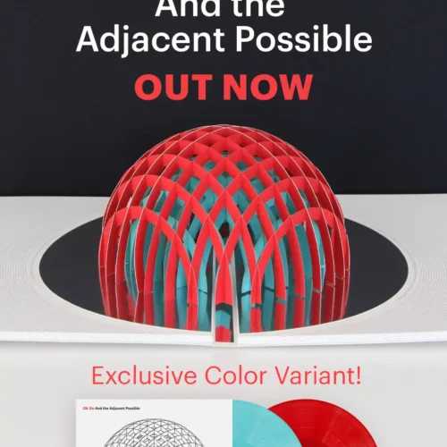 Cover art for OKGO's "The Adjacent Possible" album, featuring a geometric sculpture and two vinyl records in blue and red color variants—celebrating physical music distribution. Text announces "OUT NOW.